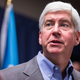 Michigan Gov. Rick Snyder speaks to the media regarding the status of the Flint water crisis on January 27, 2016, at Flint City Hall in Flint, Michigan.